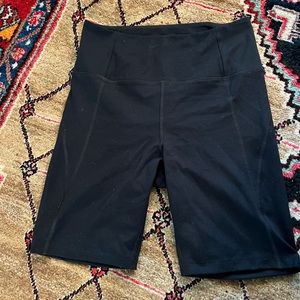 Girlfriend collective high rise biker shorts side medium
